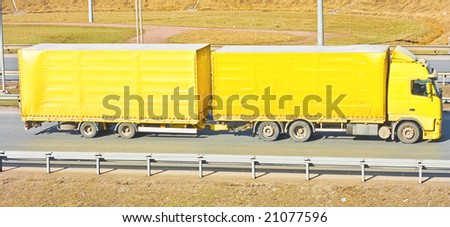 Yellow truck delivering import goods