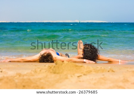Tanning happily together