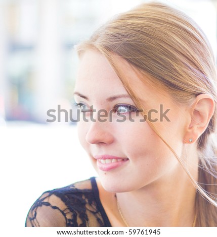 Woman Joyful in a Cafe