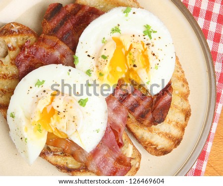 Poached eggs and bacon on toast.