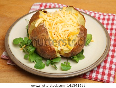 Jacket potato with shredded cheeses