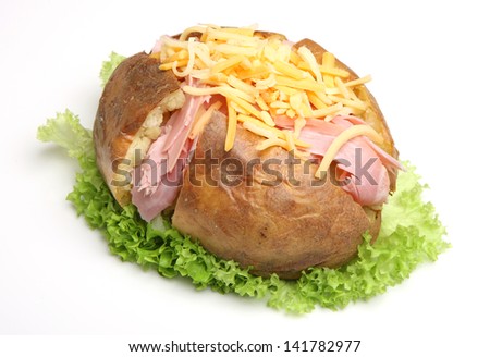 Jacket potato filled with ham and grated cheese.
