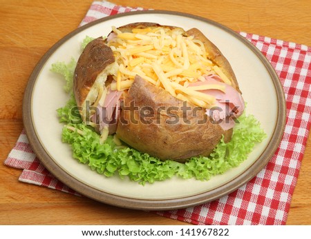 Jacket potato with ham and grated cheese