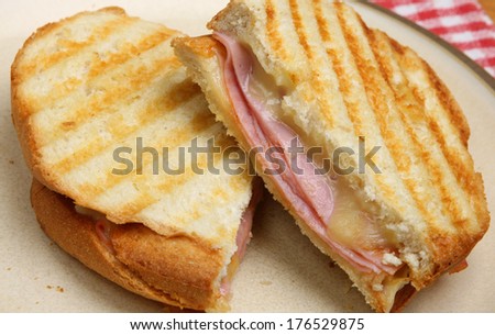 Toasted sandwich with ham and cheese.