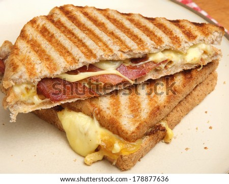Toasted sandwich with bacon, egg and cheese