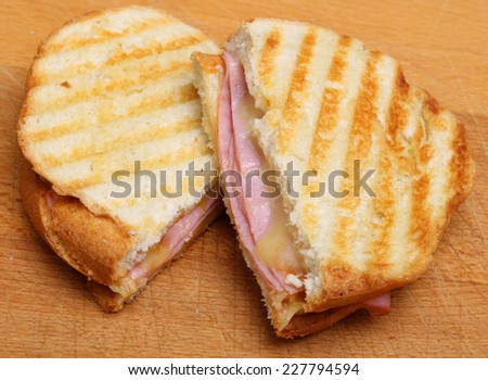Toasted sandwich or panini with ham and cheese.