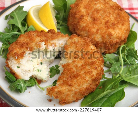 Cod fishcakes with rocket, spinach and watercress salad.