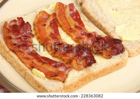 Bacon sandwich being made with wholewheat bread