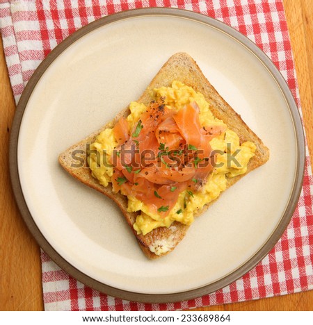 Scrambled eggs with smoked salmon on toast.