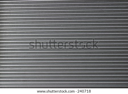 Galvanized Steel Roller Shutter Door, suitable for use as industrial background.
