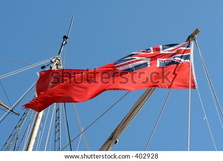 British maritime flag flying from the stern of a tall sailing ship
