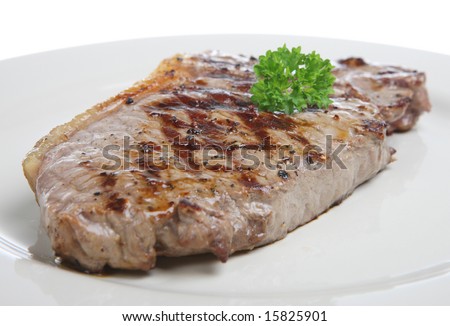 stock-photo-seasoned-sirloin-steak-garnished-with-parsley-15825901.jpg