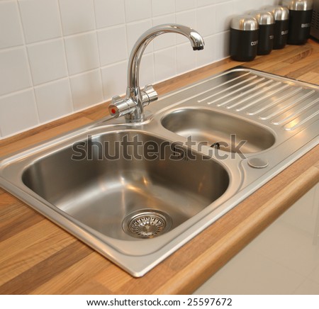 Kitchen sink with mixer tap