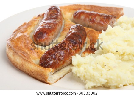 Traditional British dish of sausages baked in batter, aka 'toad in the hole'