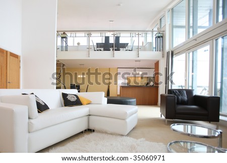Modern Open-Plan Apartment. Living Room In Foreground With Kitchen ...