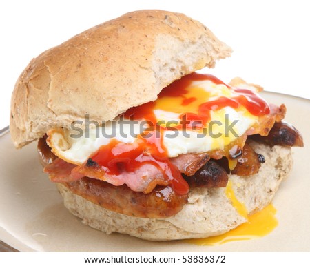 stock-photo-granary-bread-roll-with-fried-egg-bacon-sausage-and-tomato-ketchup-53836372.jpg