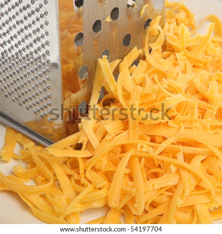 Grated cheese with grater.