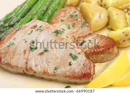 Tuna steaks with asparagus and new potatoes.