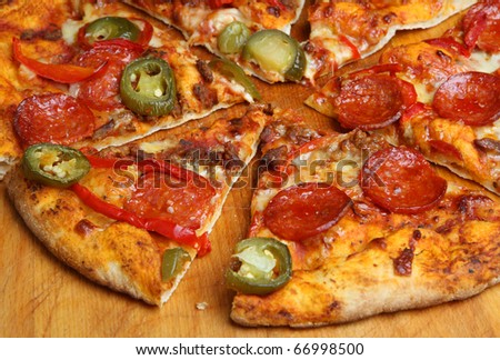 Spicy pizza with pepperoni, chili beef, green chillies and red peppers.