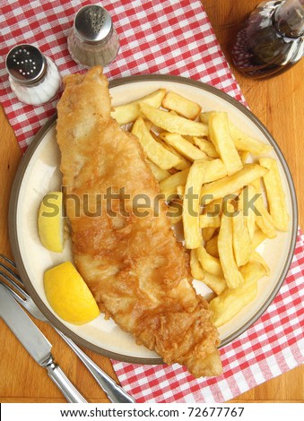Large fried cod fillet with chunky chips.