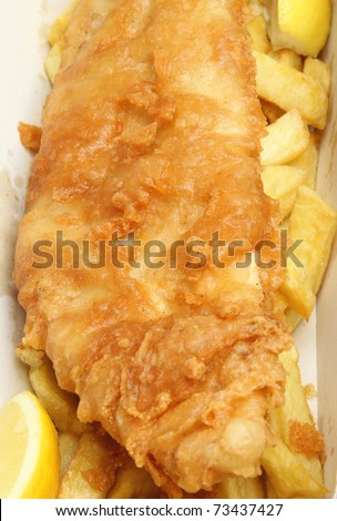 Cod fillet with chips in takeaway food container.