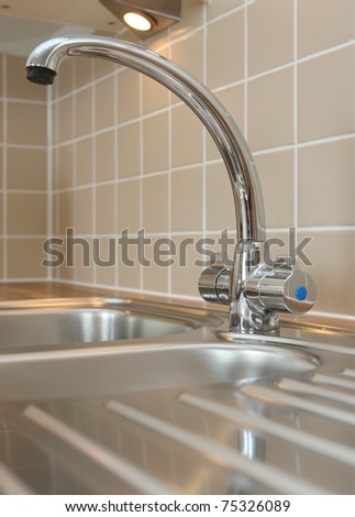 Modern curved mixer tap