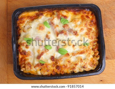 Freshly baked family-sized pasta ready meal with chicken, bacon and cheese.