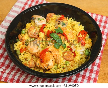 Paella ready meal with shrimp, chicken and chorizo.