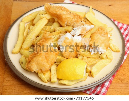 Battered fried fish with chunky chips.