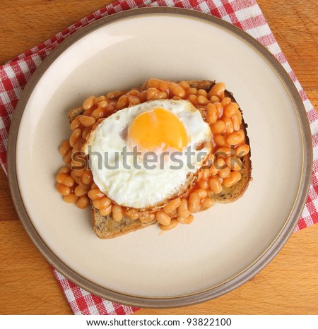 Baked beans on toast with fried egg.