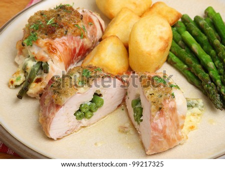 Chicken breasts stuffed with green beans and cheese wrapped in Parma ham.
