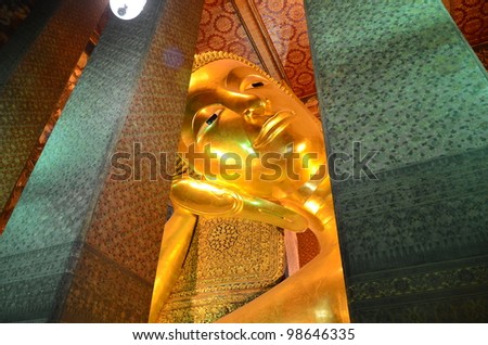 Reclining Buddha at Wat Pho. As long reclining Buddha is the third largest country.