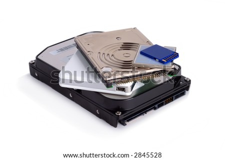Heap of different storage devices isolated over white background