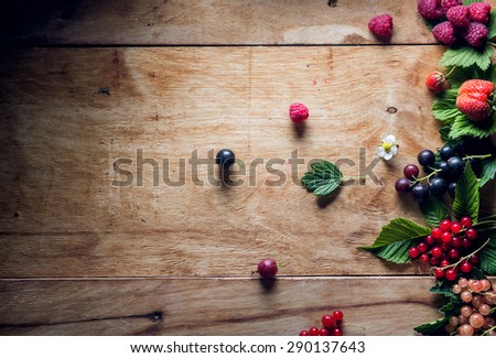 Fresh berries on wooden background table top view