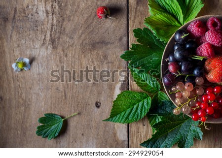 Fresh berries on wooden background table top view