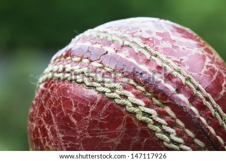 Worn out old cricket ball