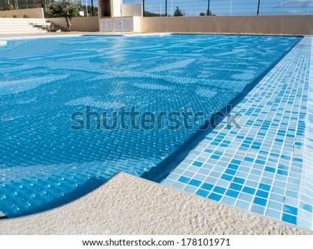 The cover of swimming pool  which also lets the pool heat up from the sun.