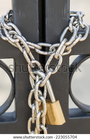Gates locked with a chain and padlock