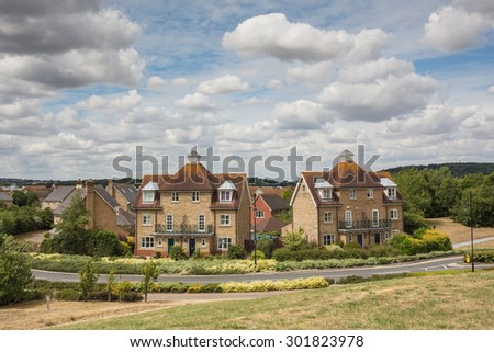 Residential semi-detatched town houses on St Mary\'s Island in Chatham, Kent, uk. The houses have spacious green areas around them.