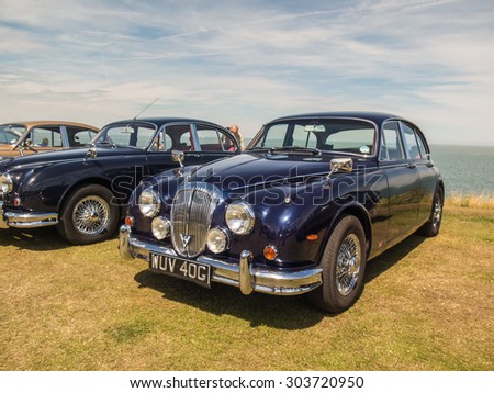 Whitstable, UK, 2nd August 2015. A blue vintage Jaguar car is on display for visitors to Tankerton slopes to enjoy during the classic car motor show in Whitstable, Kent.