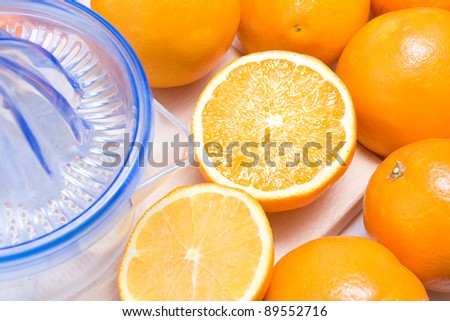 Close-open with an orange juicer orange accompanied