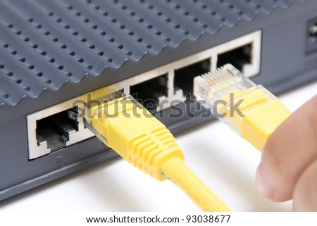 Two yellow wires connected to a router