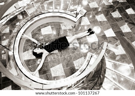 elegant slim girl lying on the floor in sepia