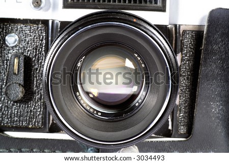 Old SLR camera lens shot isolated on a white background