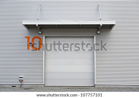 Industrial unit with roller shutter door.