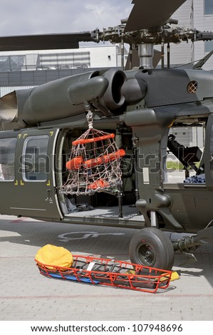 Close-up of the military helicopter with rescue equipment.