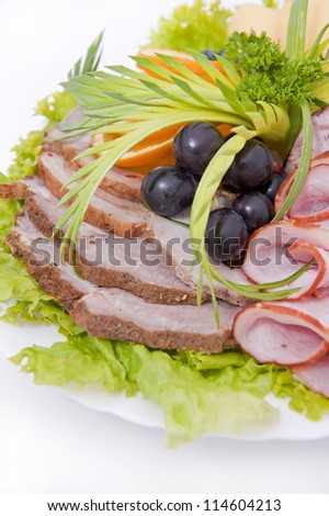 Pieces of delicious pate with smoked meat on a plate. Isolated on white background.