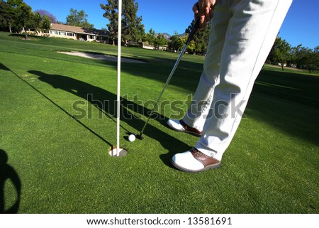 Golfer On Putting Green