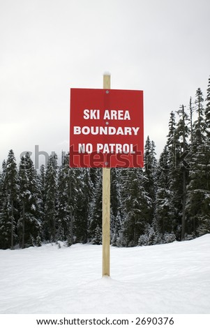 Boundary sign at ski slope warning of no patrol.
