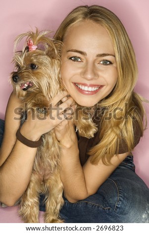 Caucasian young adult female with Yorkshire Terrier dog.